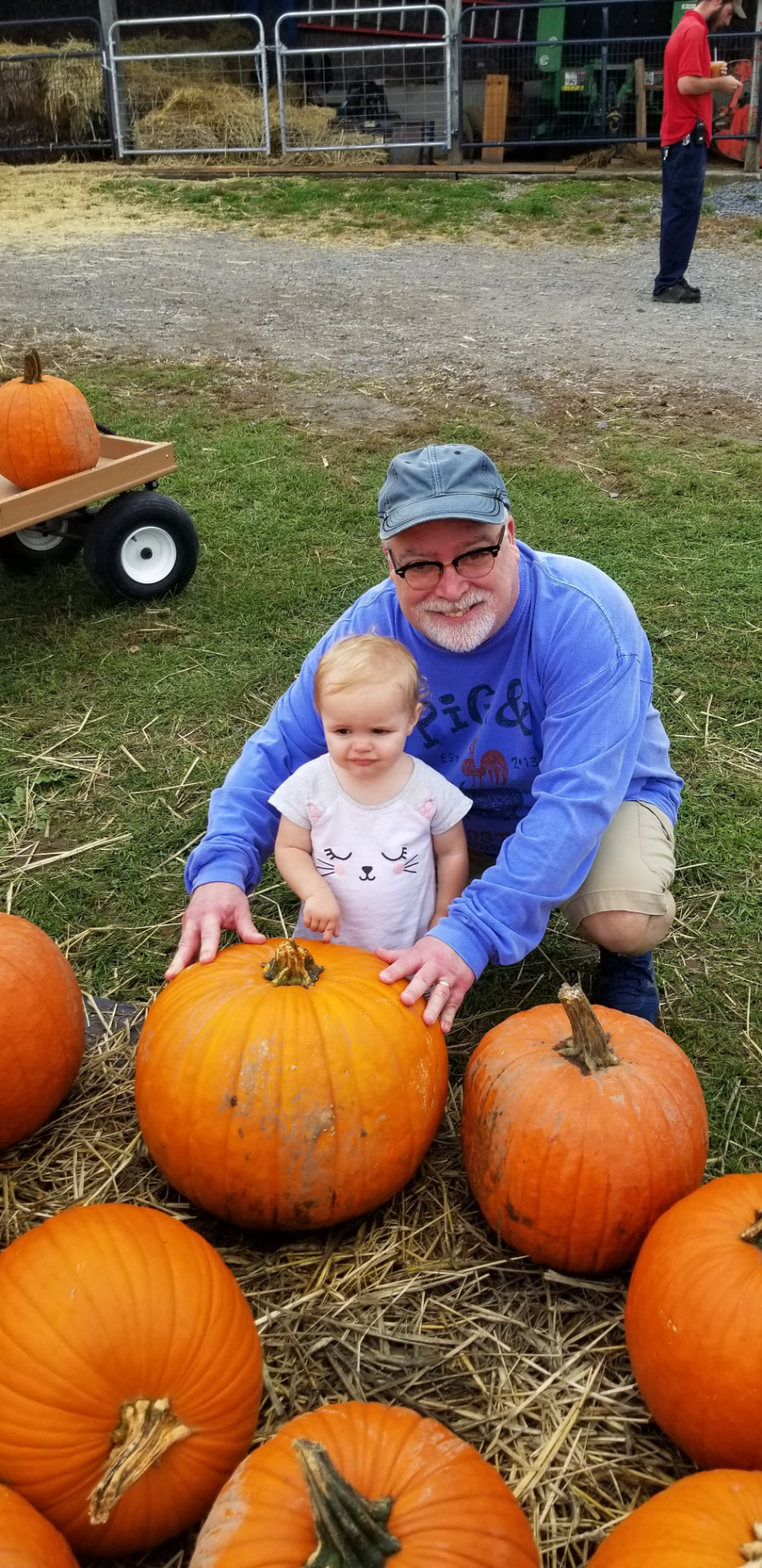 Al Sarrantonio with a child among pumpkins